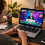 Player enjoying jogoluck blackjack on a laptop in stylish home office